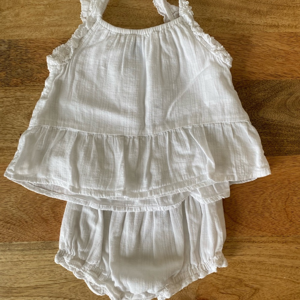 White ruffled baby outfit